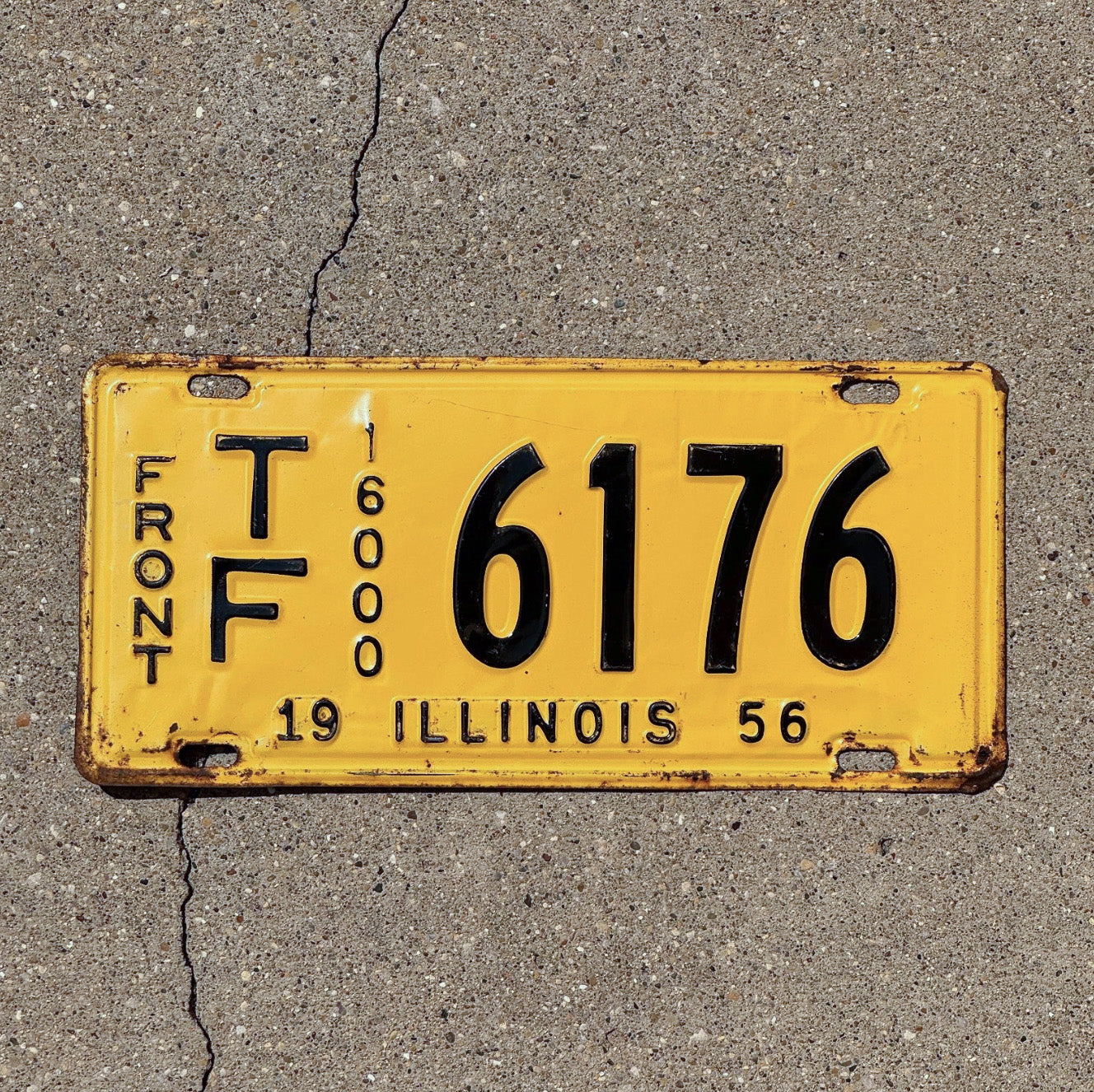 Photo of a 1956 Illinois Truck Mileage Tax License Plate Auto Tag Garage Decor Vintage TF 6176 with original patina