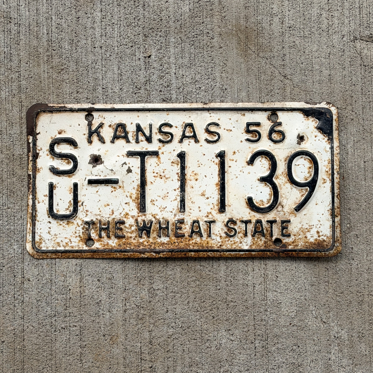 Photo of a 1956 Kansas Truck License Plate Auto Tag Garage Decor Vintage SU T 1139 with original patina