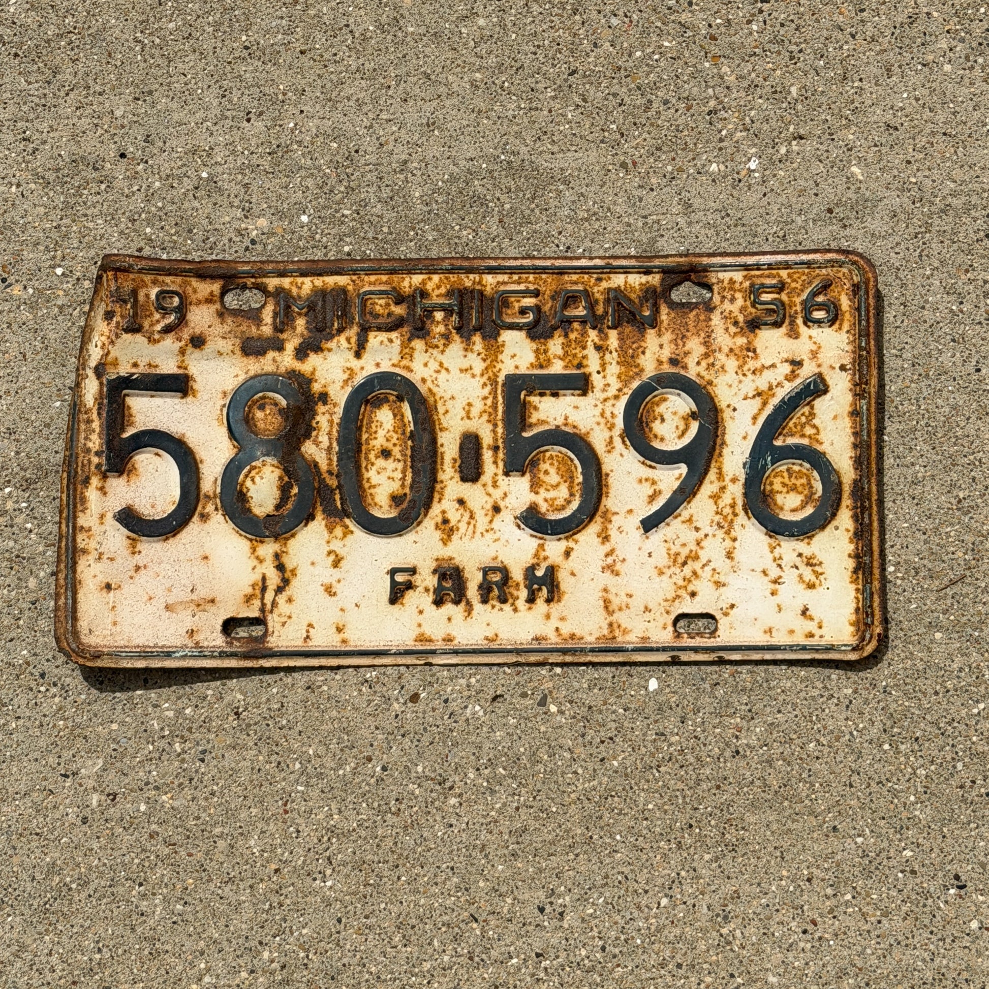 Photo of a 1956 Michigan Farm License Plate Auto Tag Garage Decor Vintage 580 596 with original patina