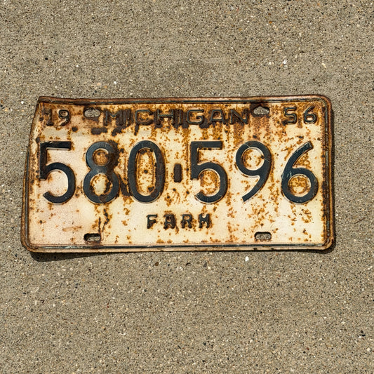 Photo of a 1956 Michigan Farm License Plate Auto Tag Garage Decor Vintage 580 596 with original patina