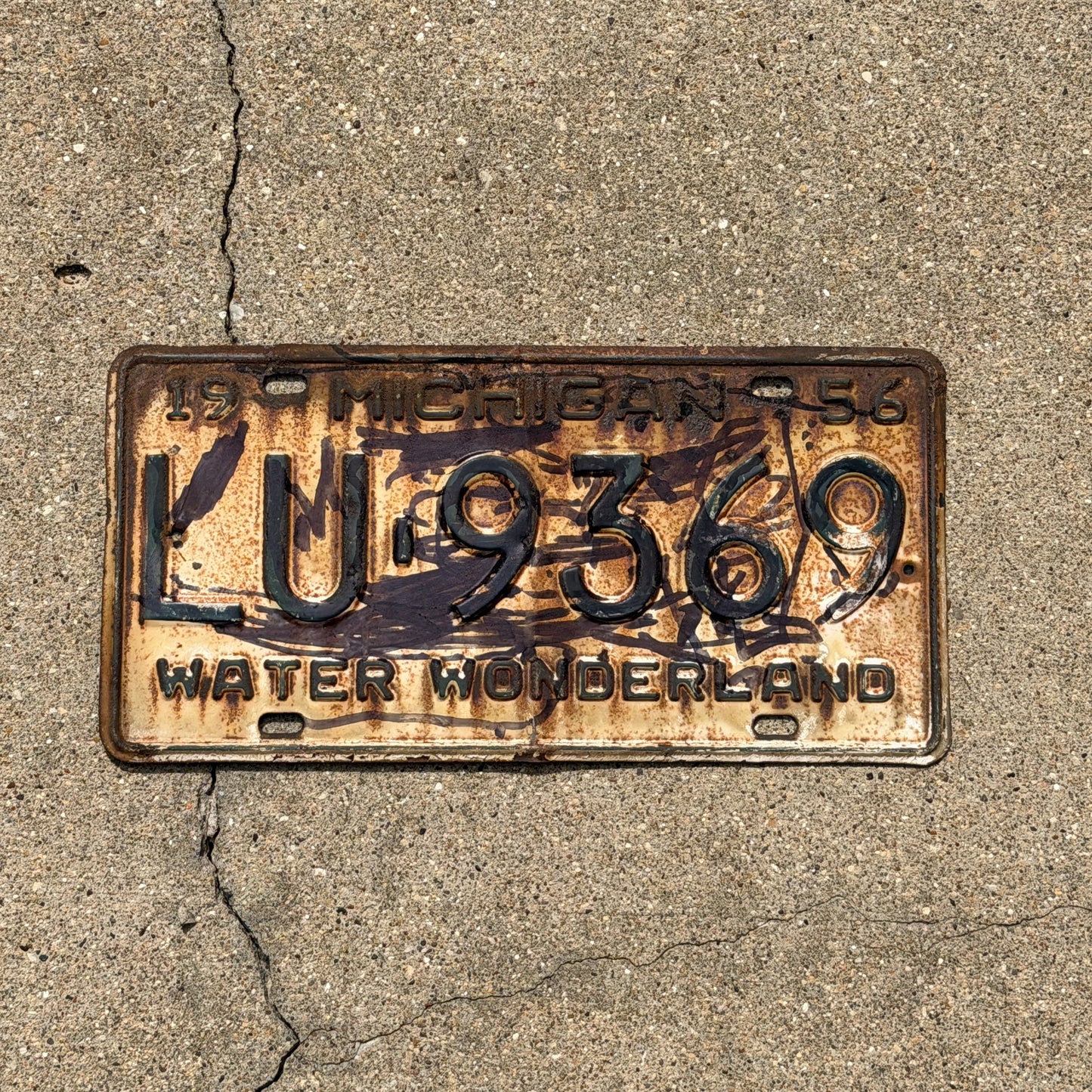 Photo of a 1956 Michigan License Plate Auto Tag Garage Decor Vintage LU 9369 with original patina