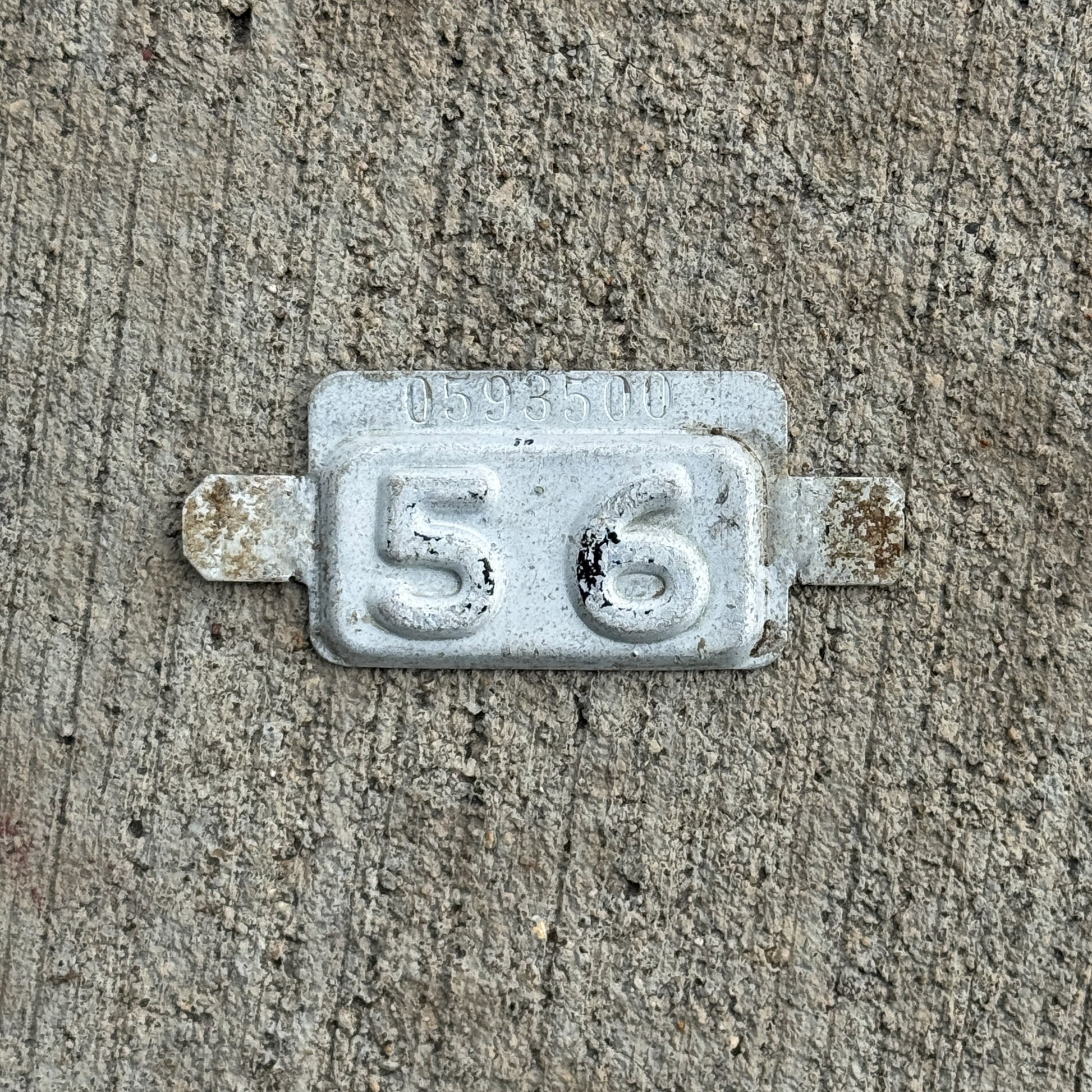 Photo of a 1956 New Jersey Tab License Plate Auto Tag 1 Vintage 0593500 with original patina