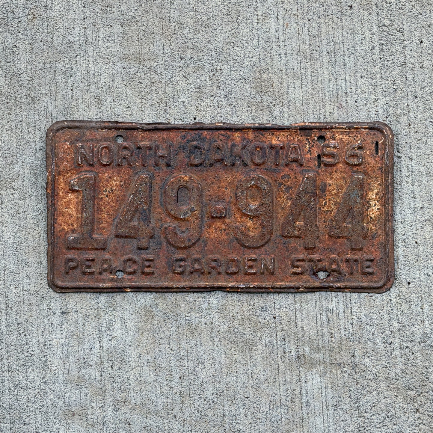 Photo of a 1956 North Dakota License Plate Auto Tag Garage Decor Vintage 149 944 with original patina