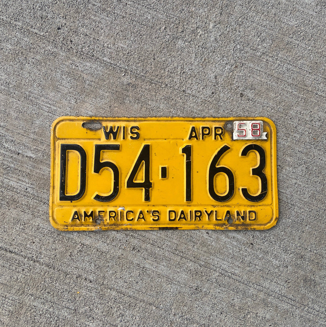 Photo of a 1957 1958 Wisconsin License Plate Auto Tag Garage Decor Vintage D 54 163 with original patina