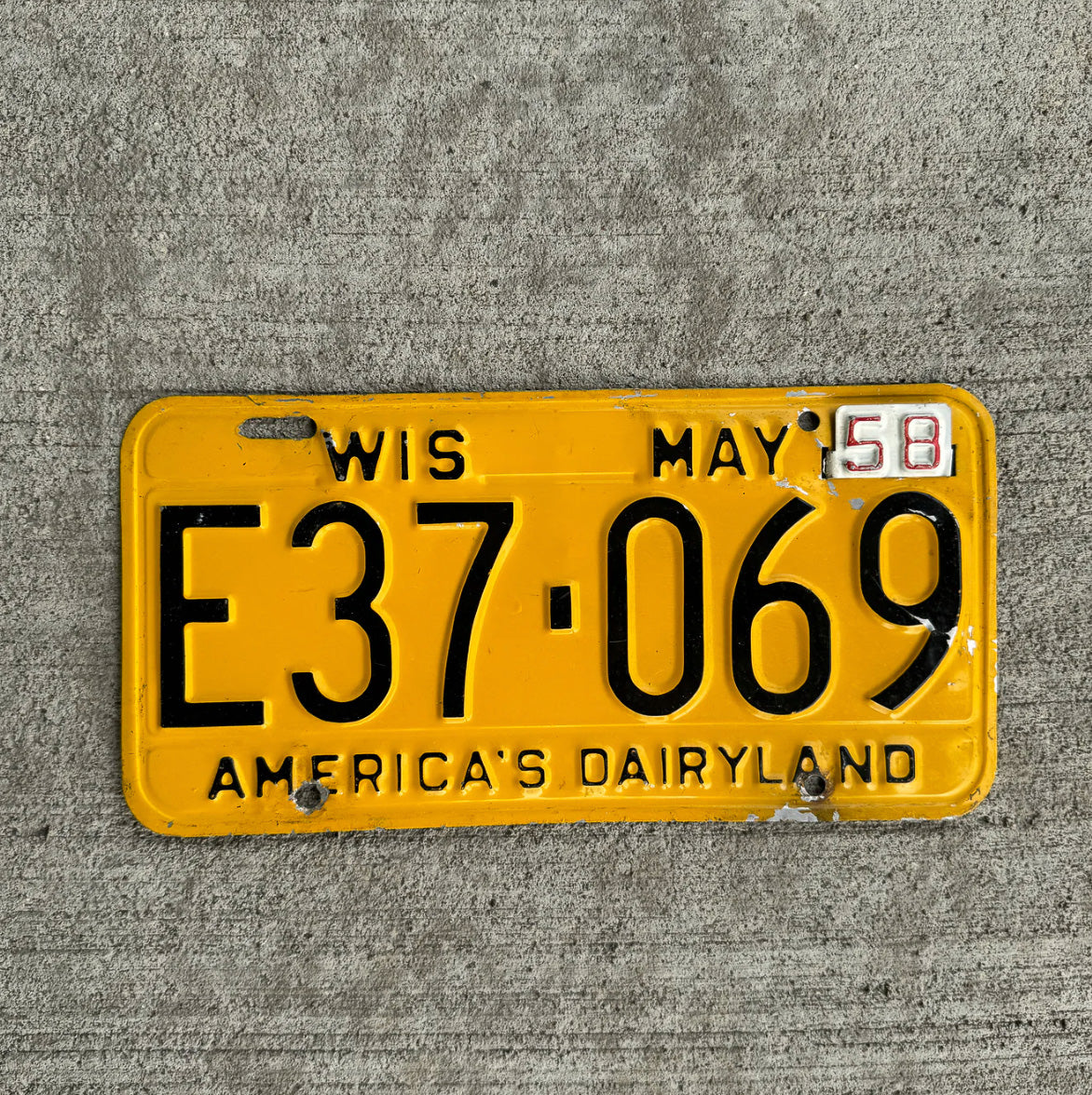 Photo of a 1957 1958 Wisconsin License Plate Auto Tag Garage Decor Vintage E 37 069 with original patina