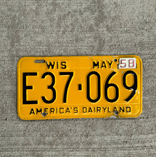Photo of a 1957 1958 Wisconsin License Plate Auto Tag Garage Decor Vintage E 37 069 with original patina