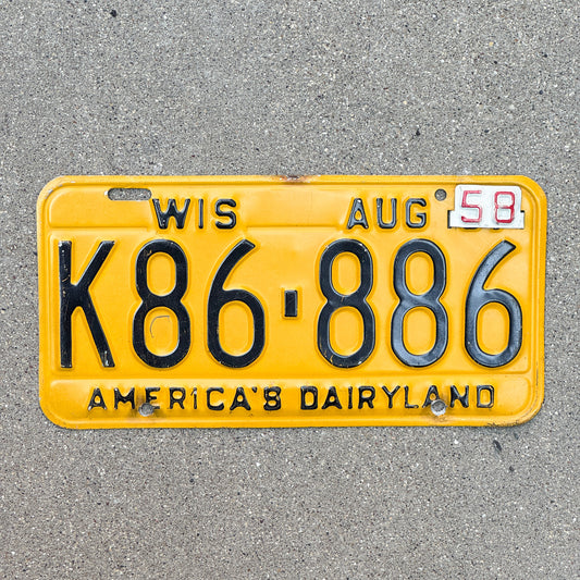 Photo of a 1957 1958 Wisconsin License Plate Auto Tag Garage Decor Vintage Full House K86 886 with original patina