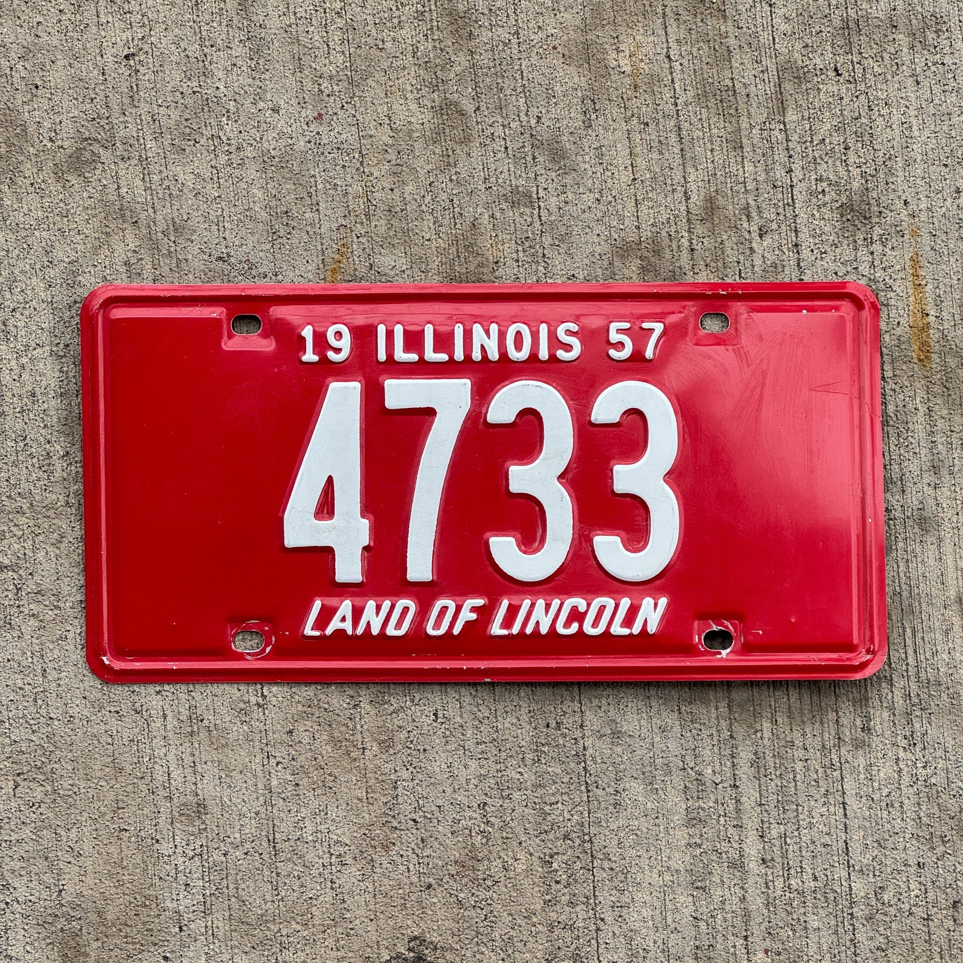 Photo of a 1957 Illinois License Plate Auto Tag Garage Decor Vintage Low Number Four Digit 4733 with original patina