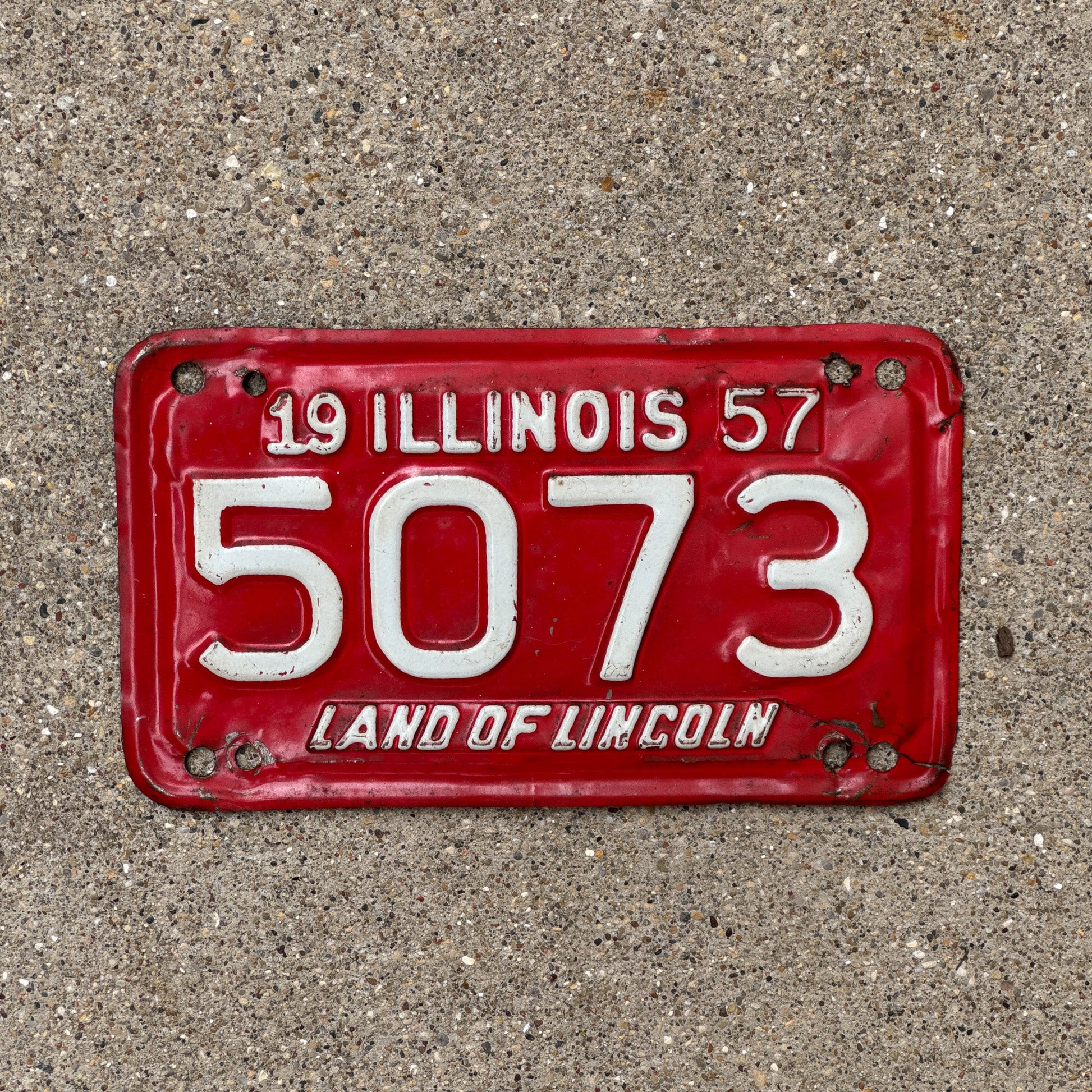 Photo of a 1957 Illinois Motorcycle License Plate Auto Tag Garage Decor Vintage Low Number Four Digit 5073