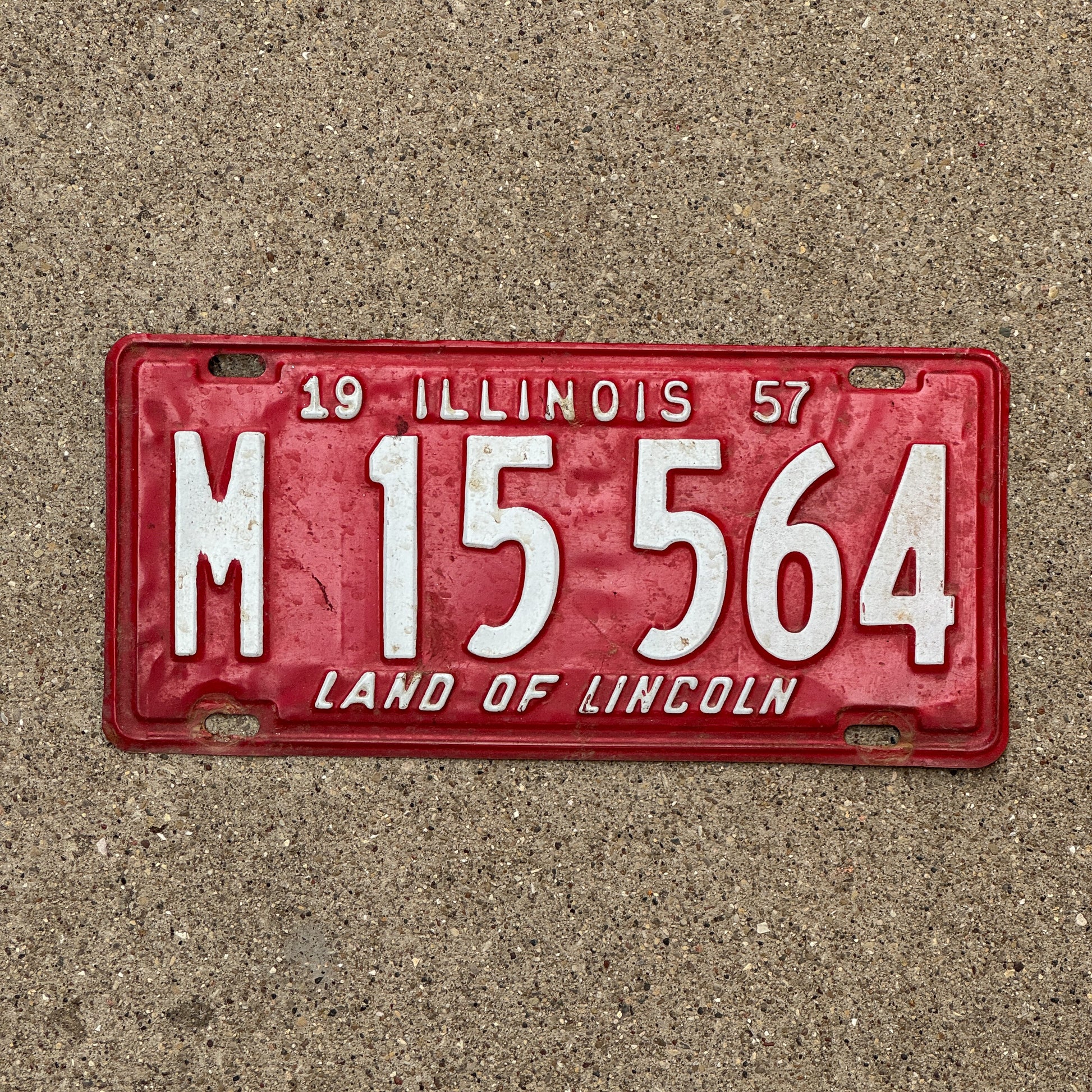 Photo of a 1957 Illinois Municipal License Plate Auto Tag 1 Vintage Garage M 15 564 with original patina