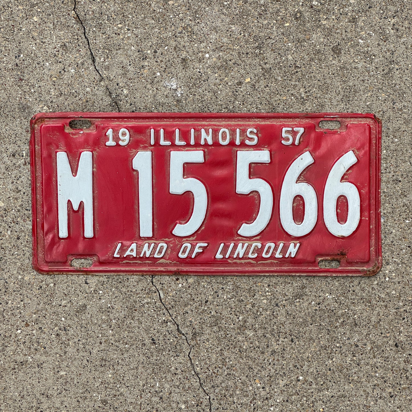 Photo of a 1957 Illinois Municipal License Plate Auto Tag 1 Vintage Garage M 15 566 with original patina