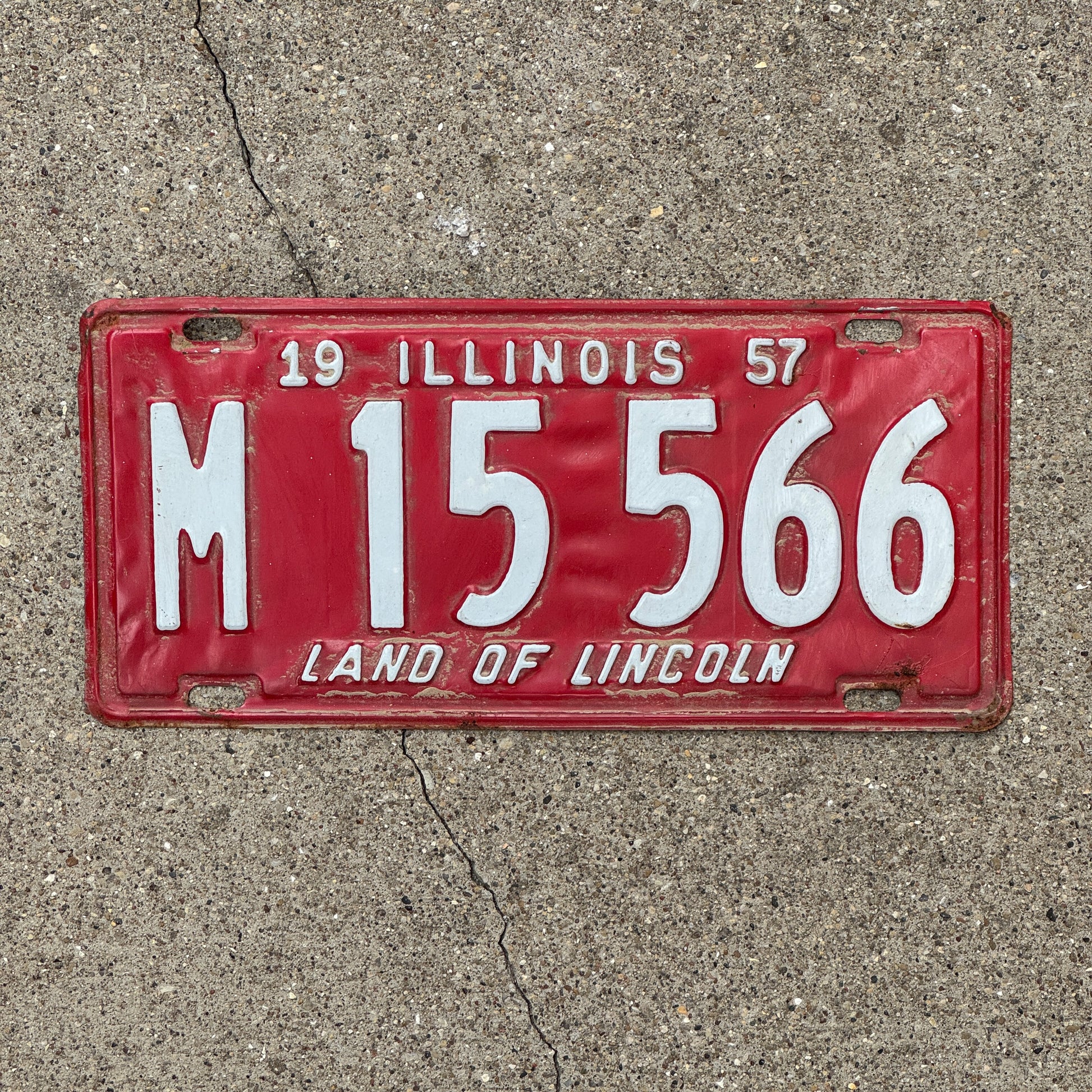 Photo of a 1957 Illinois Municipal License Plate Auto Tag 1 Vintage Garage M 15 566 with original patina