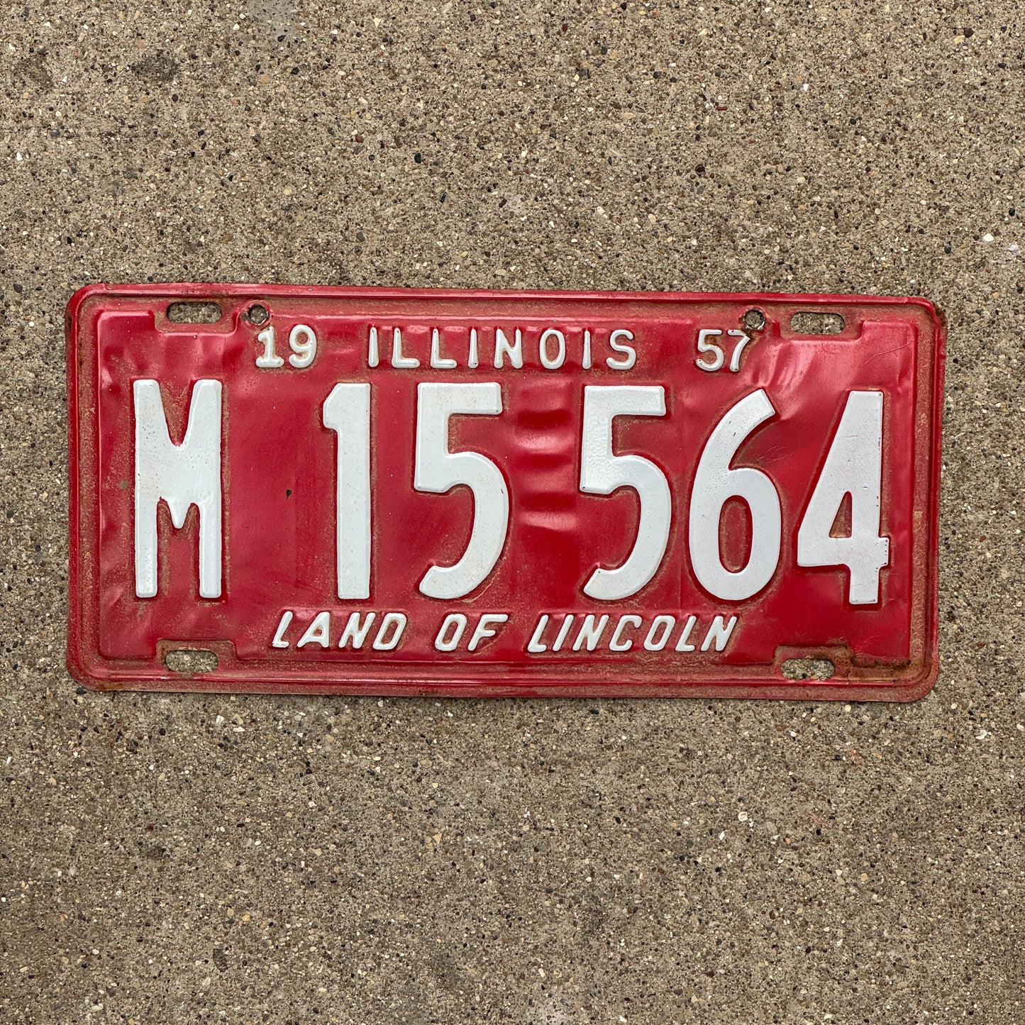 Photo of a 1957 Illinois Municipal License Plate Auto Tag 2 Vintage Garage M 15 564 with original patina