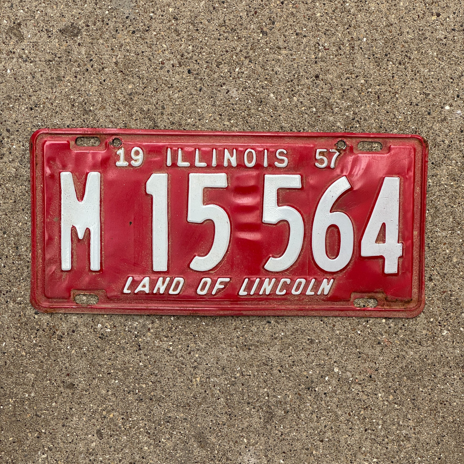 Photo of a 1957 Illinois Municipal License Plate Auto Tag 2 Vintage Garage M 15 564 with original patina