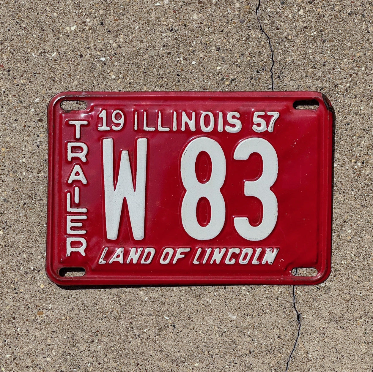 Photo of a 1957 Illinois Trailer License Plate Auto Tag Garage Decor Vintage Low Number Two Digit W 83 with original patina