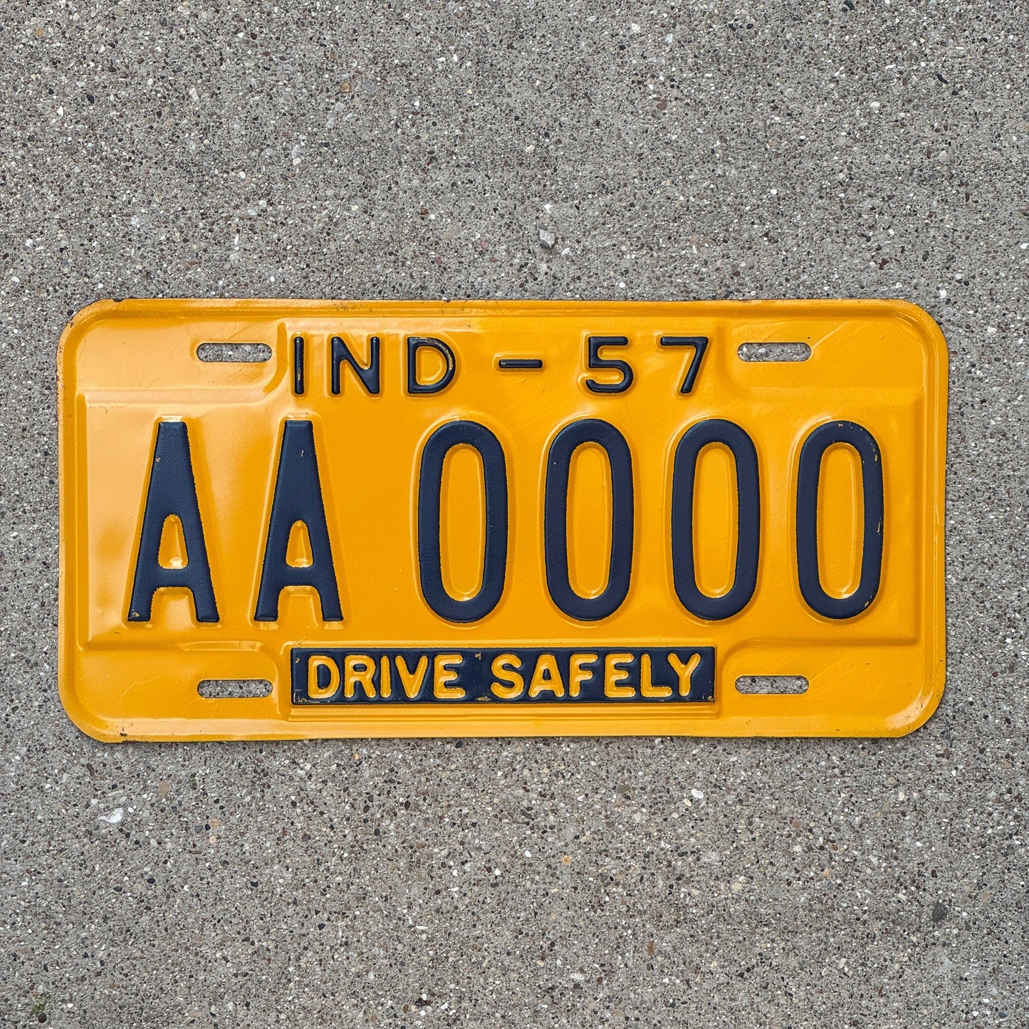 Photo of a 1957 Indiana Sample License Plate Auto Tag Garage Decor Vintage AA0000 with original patina