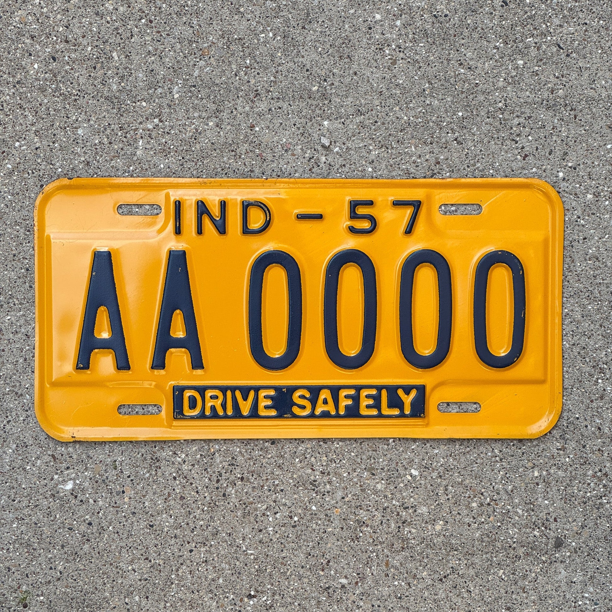 Photo of a 1957 Indiana Sample License Plate Auto Tag Garage Decor Vintage AA0000 with original patina