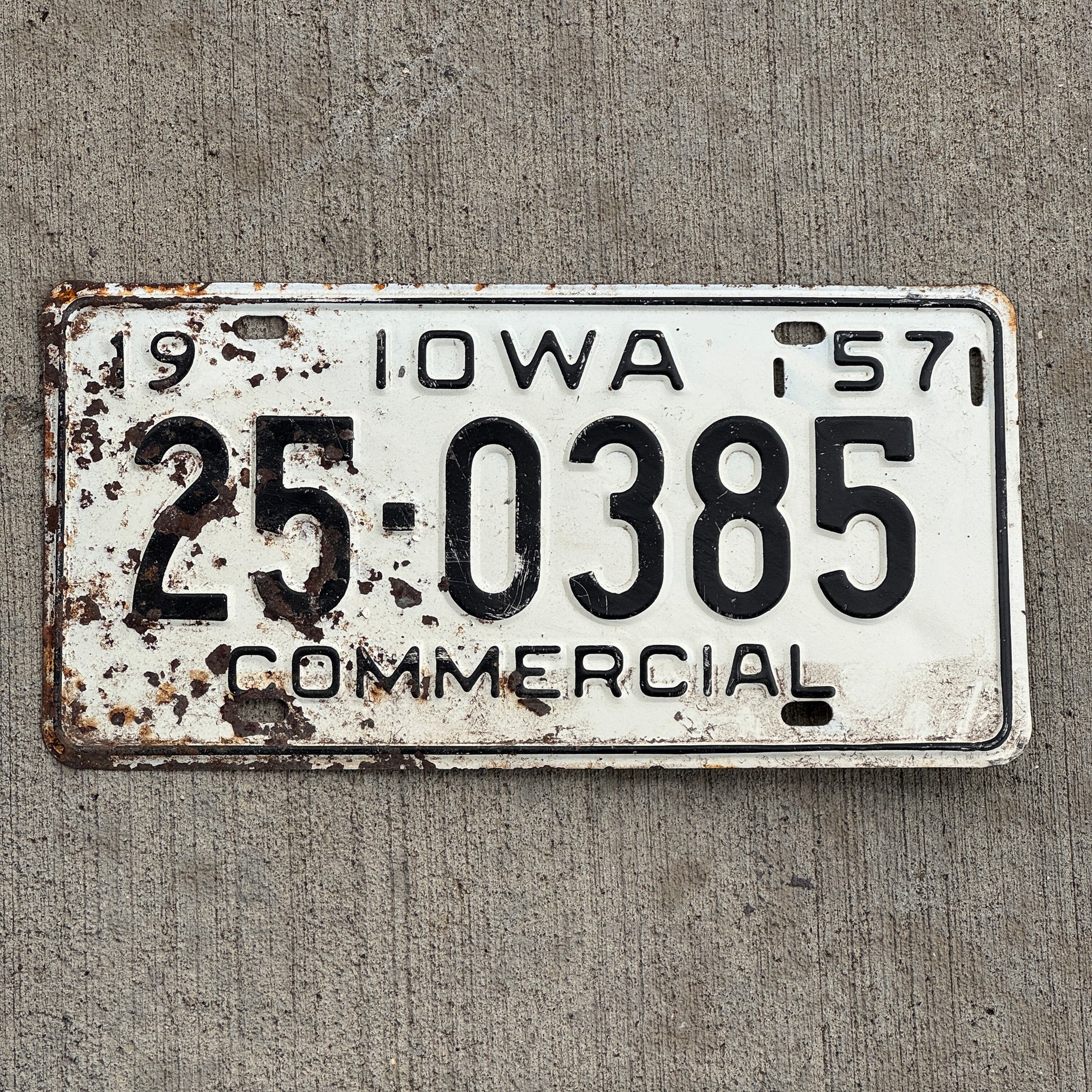 Photo of a 1957 Iowa Commercial License Plate Auto Tag Garage Decor Vintage 25 0385 with original patina