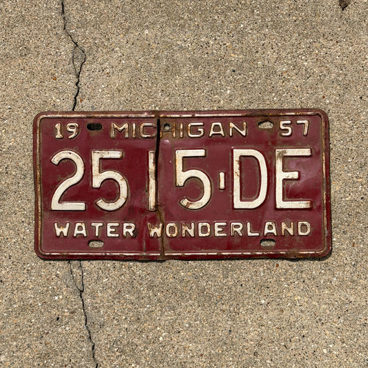 Photo of a 1957 Michigan Commercial License Plate Auto Tag Garage Decor Vintage 2515 DE with original patina
