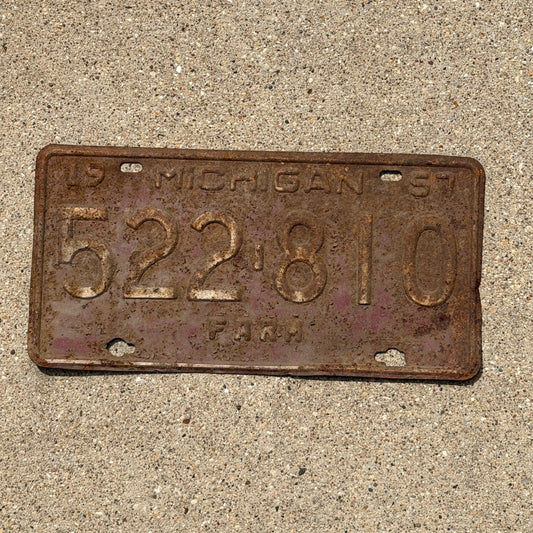 Photo of a 1957 Michigan Farm License Plate Auto Tag Garage Decor Vintage 522 810 with original patina