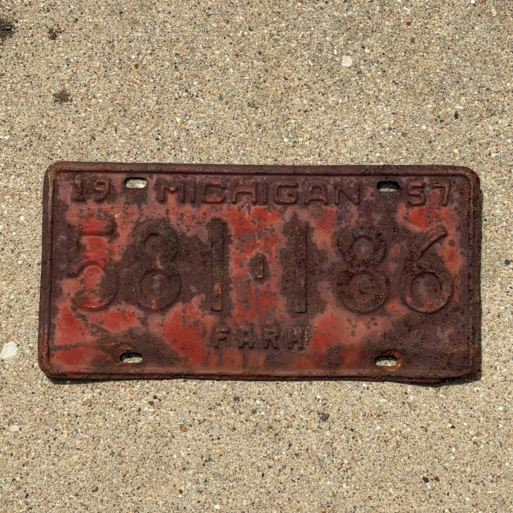 Photo of a 1957 Michigan Farm License Plate Auto Tag Garage Decor Vintage 581 186 with original patina