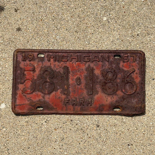 Photo of a 1957 Michigan Farm License Plate Auto Tag Garage Decor Vintage 581 186 with original patina