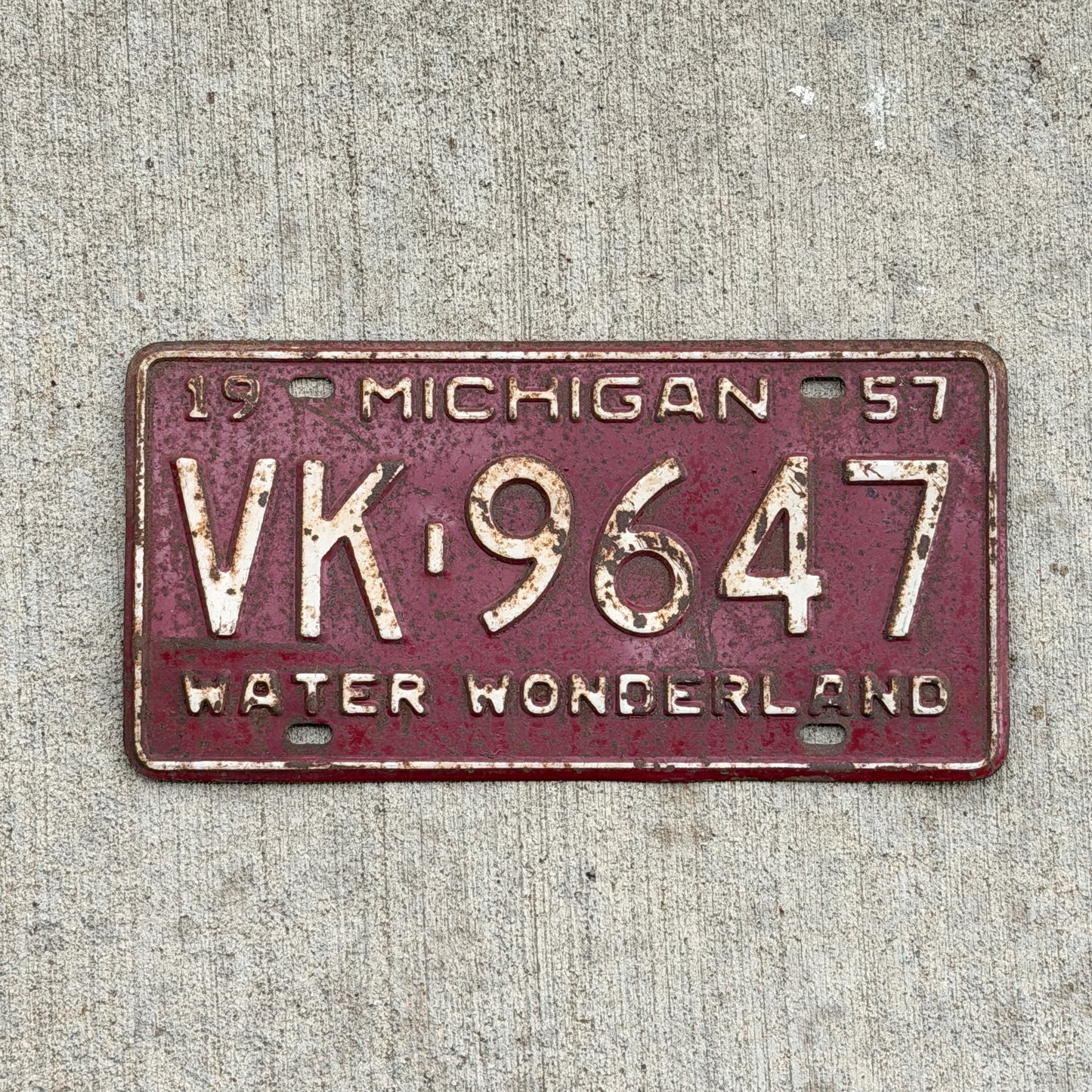 Photo of a 1957 Michigan License Plate Auto Tag Garage Decor Vintage VK 9647 with original patina