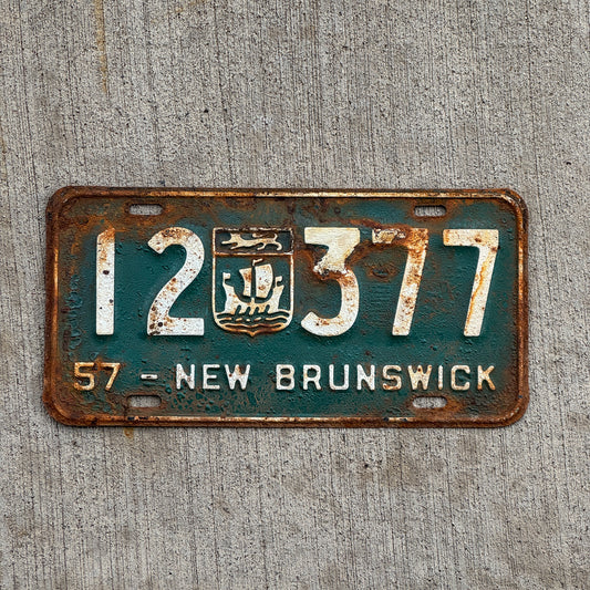Photo of a 1957 New Brunswick License Plate Auto Tag 1 Vintage Garage Provincial Coat of Arms 12 377 with original patina