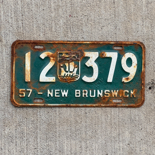 Photo of a 1957 New Brunswick License Plate Auto Tag 1 Vintage Garage Provincial Coat of Arms 12 379 with original patina