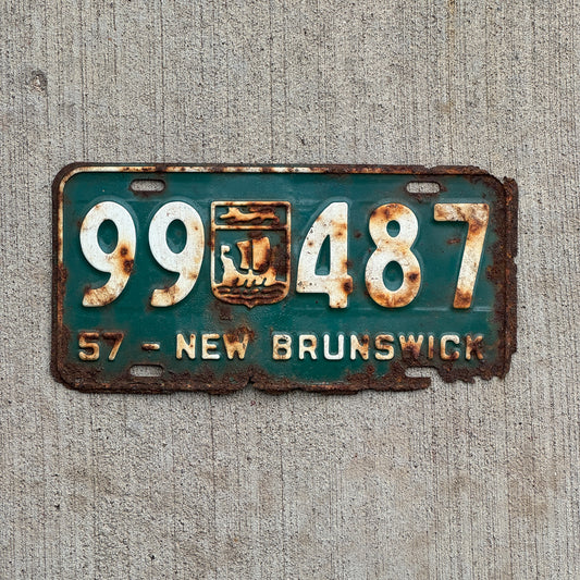 Photo of a 1957 New Brunswick License Plate Auto Tag 1 Vintage Garage Provincial Coat of Arms 99 487 with original patina