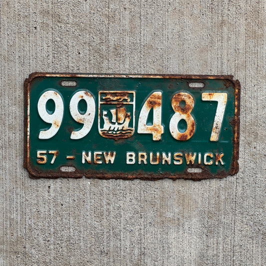 Photo of a 1957 New Brunswick License Plate Auto Tag 2 Vintage Garage Provincial Coat of Arms 99 487 with original patina