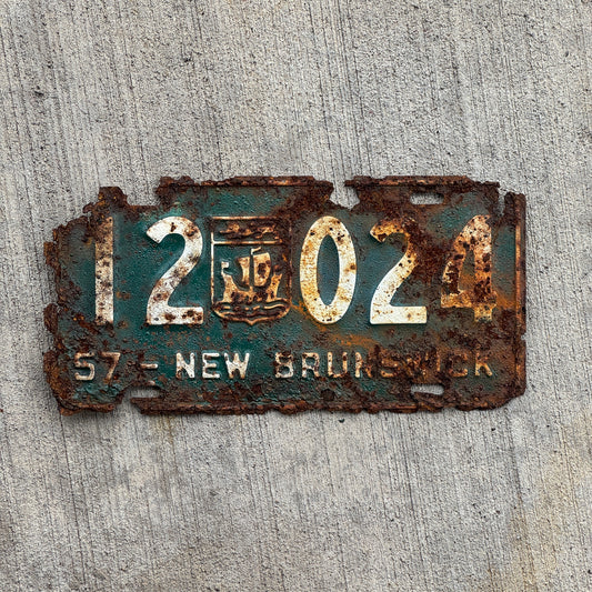 Photo of a 1957 New Brunswick License Plate Auto Tag Garage Decor Vintage Provincial Coat of Arms 12 024 with original patina