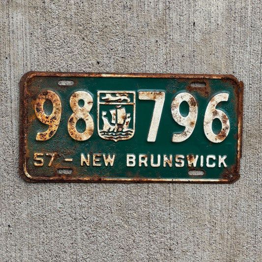 Photo of a 1957 New Brunswick License Plate Auto Tag Garage Decor Vintage Provincial Coat of Arms 98 796 with original patina