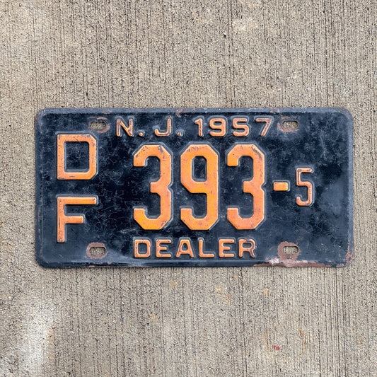 Photo of a 1957 New Jersey Dealer License Plate Auto Tag Garage Decor Vintage DF 393 5 with original patina
