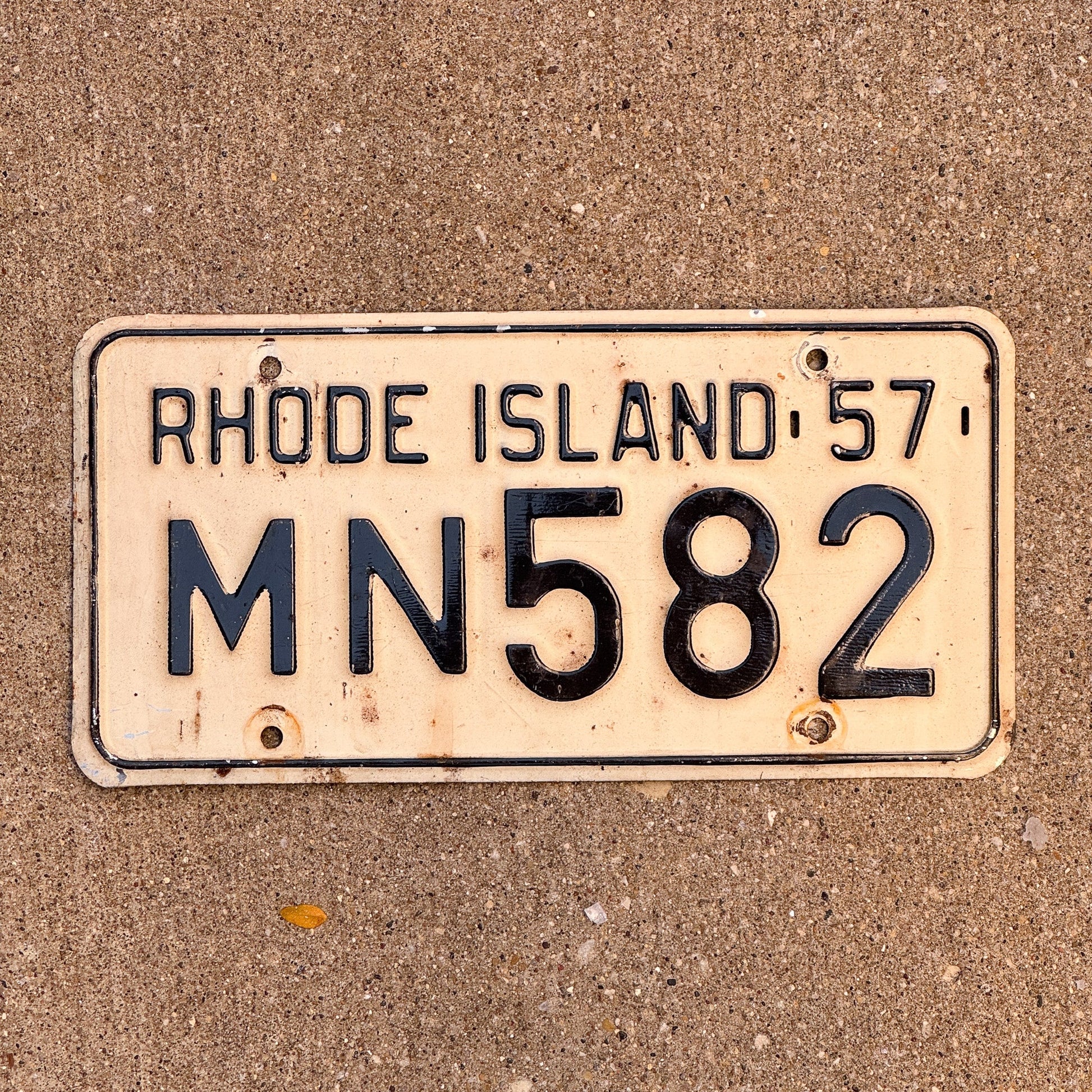 Photo of a 1957 Rhode Island License Plate Auto Tag Garage Decor Vintage MN 582 with original patina