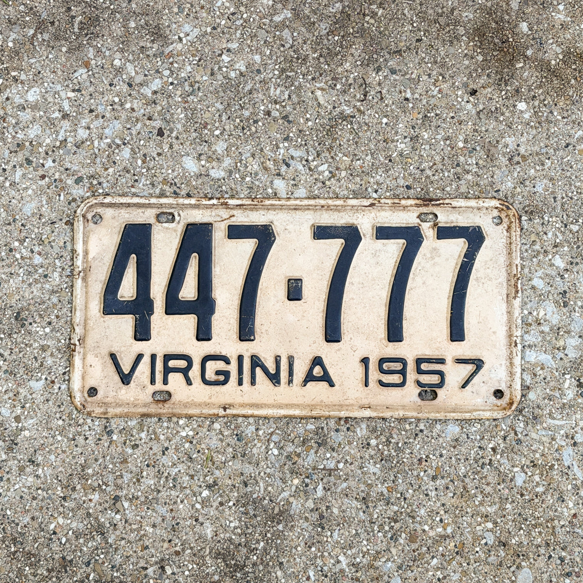 Photo of a 1957 Virginia License Plate Auto Tag Garage Decor Vintage 777 Lucky 7 Repeat Repeating 447 777 with original patina