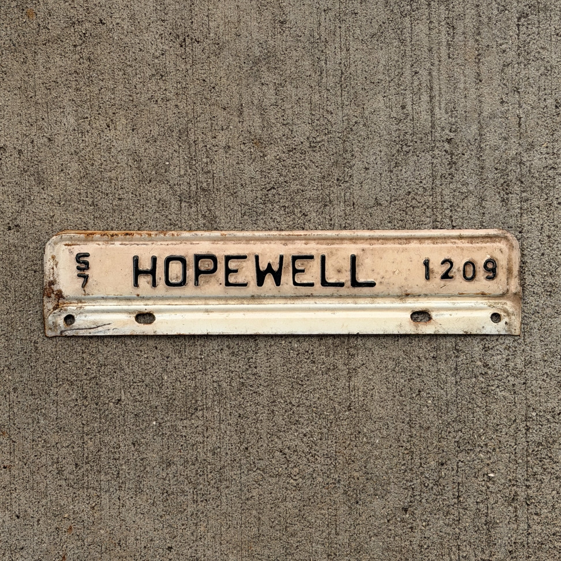 Photo of a 1957 Virginia Tax Strip License Plate Auto Tag Garage Decor Vintage Hopewell 1209 with original patina