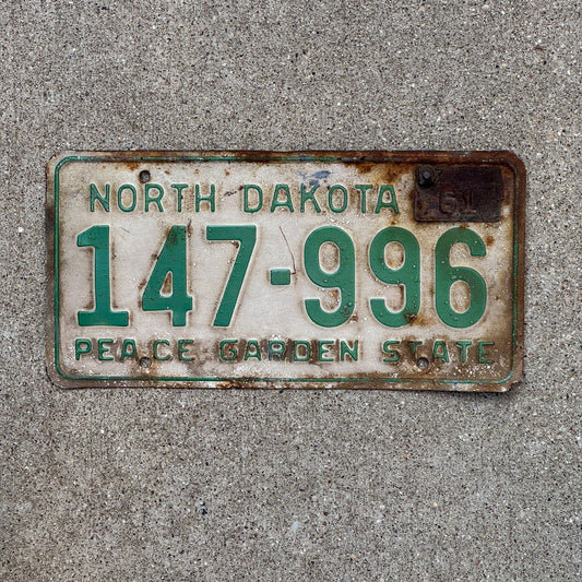 Photo of a 1958 1961 North Dakota License Plate Auto Tag Garage Decor Vintage 147 996 with original patina