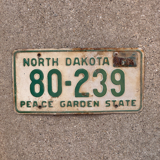 Photo of a 1958 1961 North Dakota License Plate Auto Tag Garage Decor Vintage 80 239 with original patina