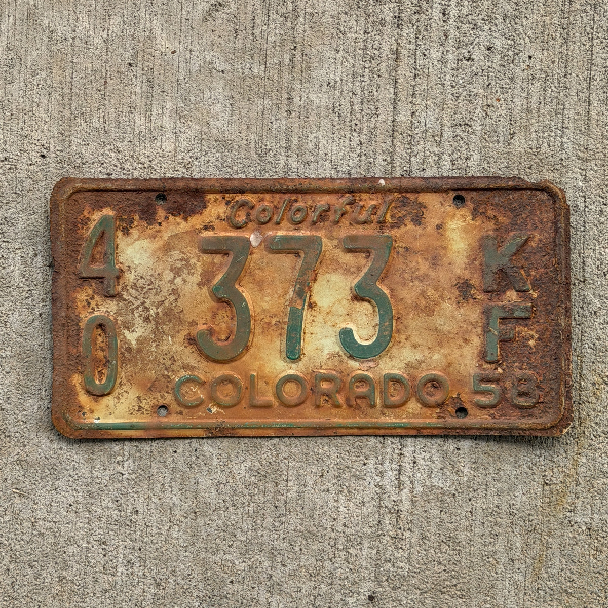 Photo of a 1958 Colorado Farm Truck License Plate Auto Tag Garage Decor Vintage 40 373 KF with original patina