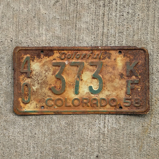 Photo of a 1958 Colorado Farm Truck License Plate Auto Tag Garage Decor Vintage 40 373 KF with original patina