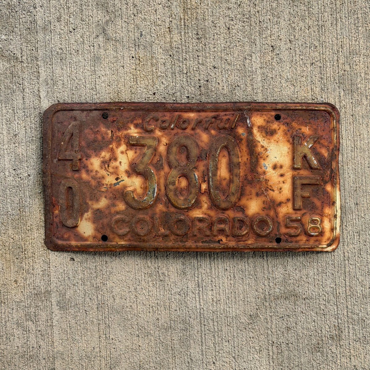 Photo of a 1958 Colorado Farm Truck License Plate Auto Tag Garage Decor Vintage 40 380 KF with original patina