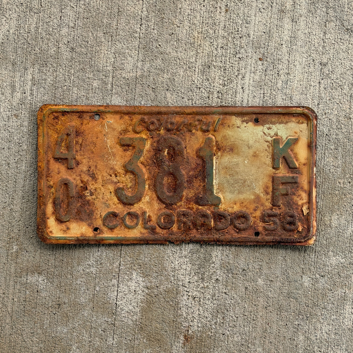Photo of a 1958 Colorado Farm Truck License Plate Auto Tag Garage Decor Vintage 40 381 KF with original patina