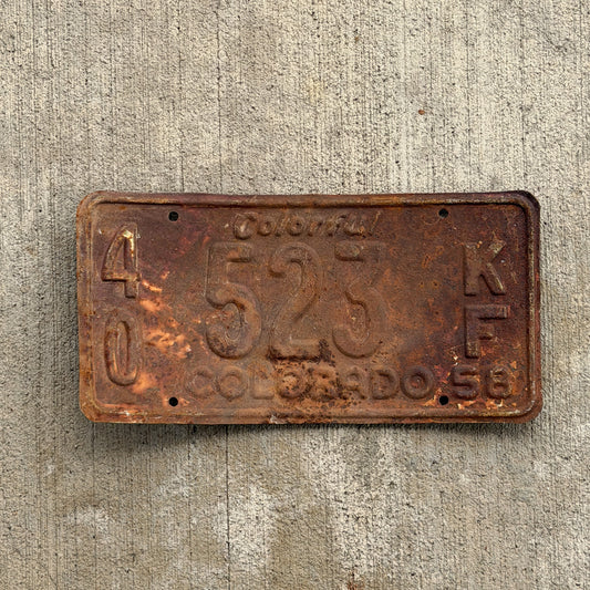 Photo of a 1958 Colorado Farm Truck License Plate Auto Tag Garage Decor Vintage 40 523 KF with original patina