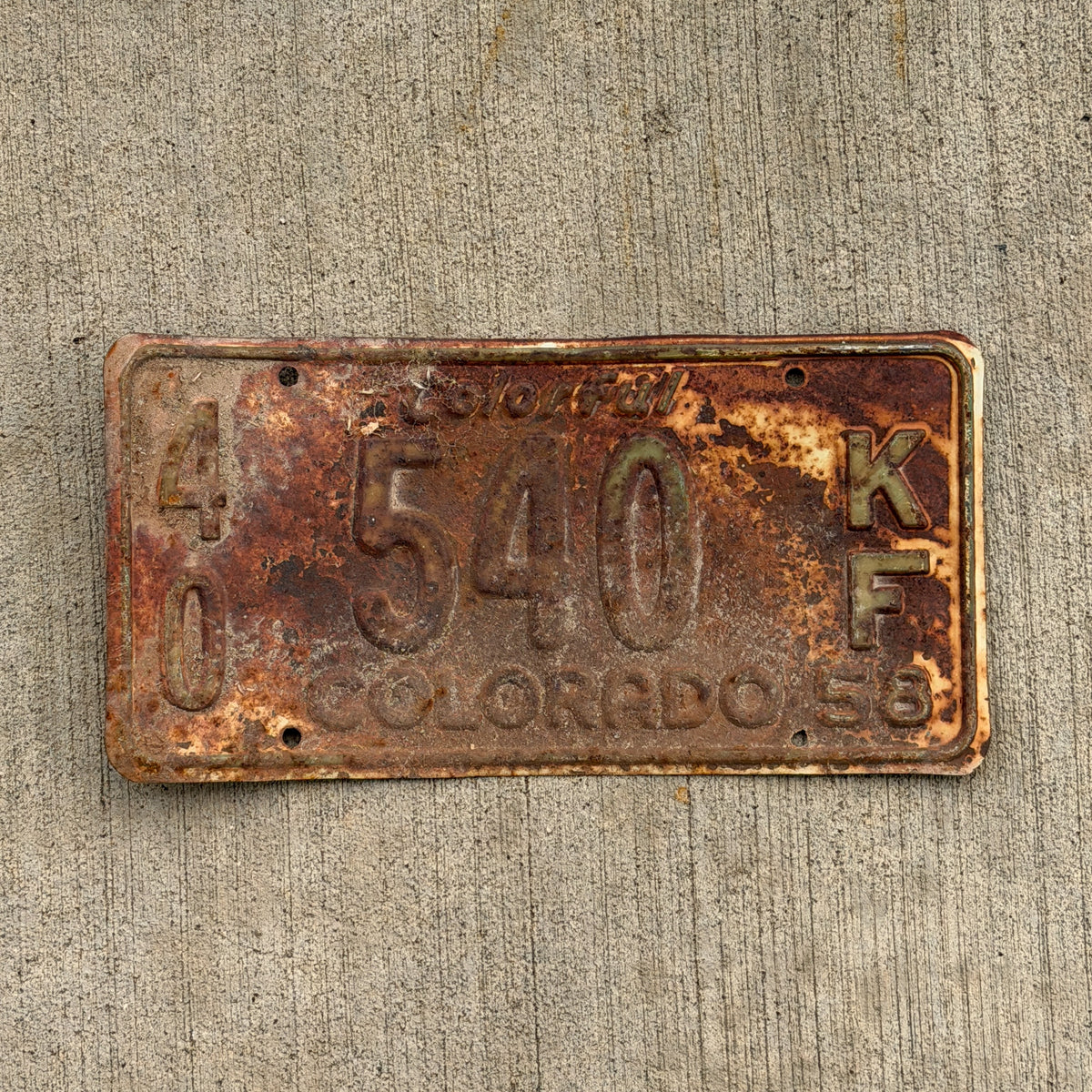 Photo of a 1958 Colorado Farm Truck License Plate Auto Tag Garage Decor Vintage 40 540 KF with original patina