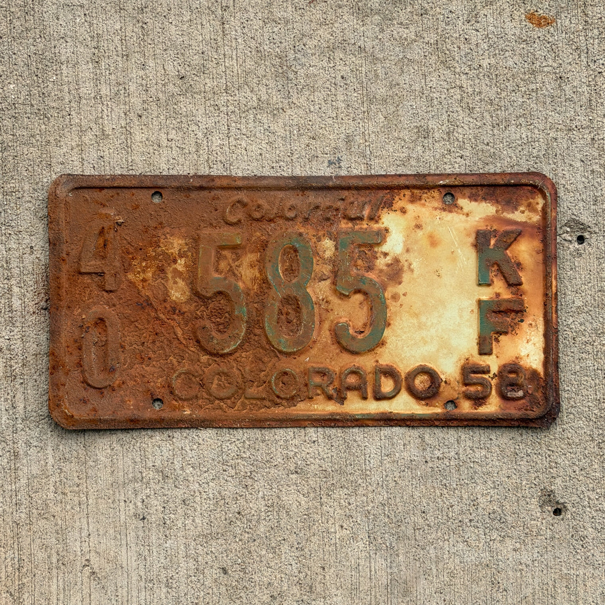 Photo of a 1958 Colorado Farm Truck License Plate Auto Tag Garage Decor Vintage 40 585 KF with original patina