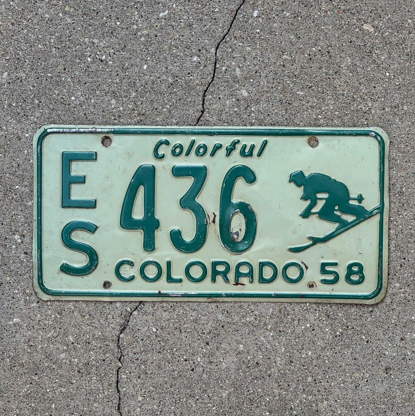Photo of a 1958 Colorado License Plate Auto Tag Garage Decor Vintage Iconic Skier ES 436 with original patina