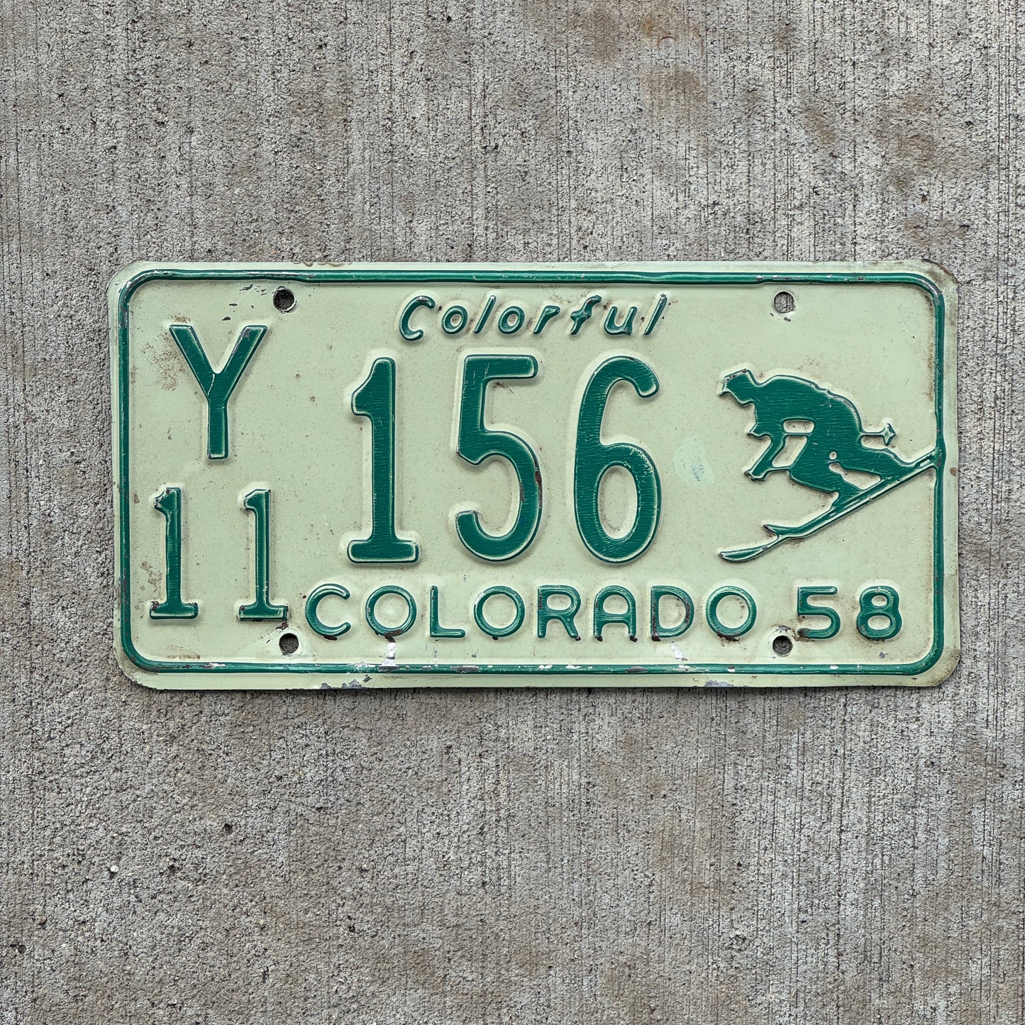Photo of a 1958 Colorado License Plate Auto Tag Garage Decor Vintage Iconic Skier Y 11 156 with original patina