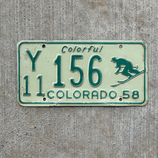 Photo of a 1958 Colorado License Plate Auto Tag Garage Decor Vintage Iconic Skier Y 11 156 with original patina