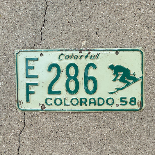 Photo of a 1958 Colorado License Plate Auto Tag Garage Decor Vintage Skies Skiing Skier EF 286 with original patina